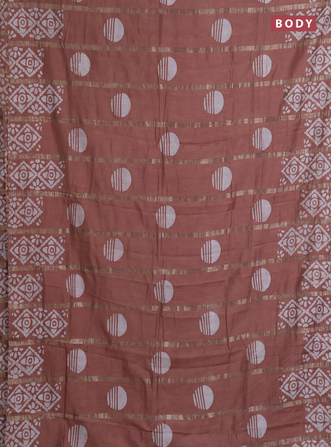 Semi chanderi saree pastel brown with allover zari strips & batik butta prints in borderless style