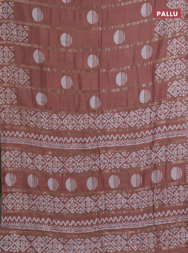 Semi chanderi saree pastel brown with allover zari strips & batik butta prints in borderless style