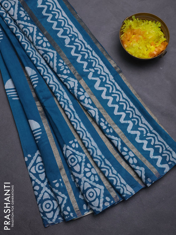 Semi chanderi saree peacock green with allover zari strips & batik butta prints in borderless style