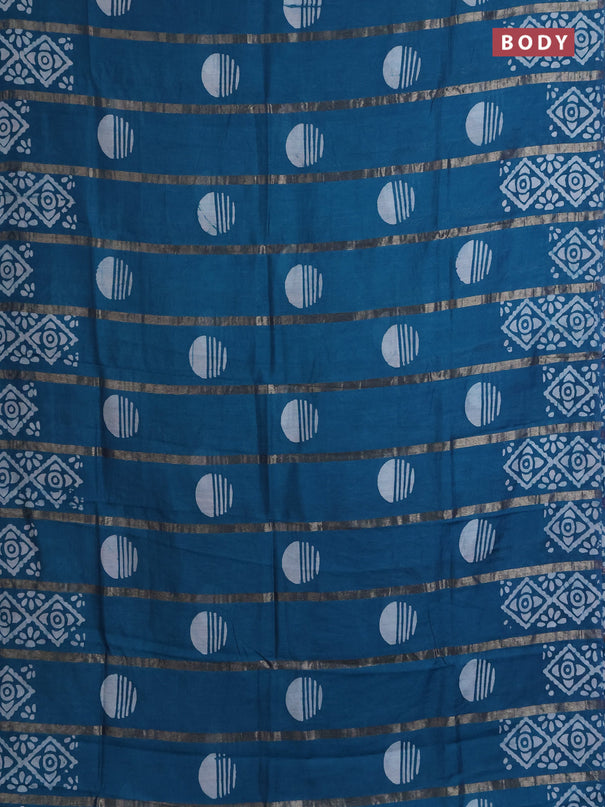 Semi chanderi saree peacock green with allover zari strips & batik butta prints in borderless style