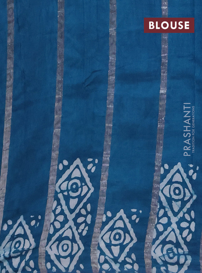 Semi chanderi saree peacock green with allover zari strips & batik butta prints in borderless style