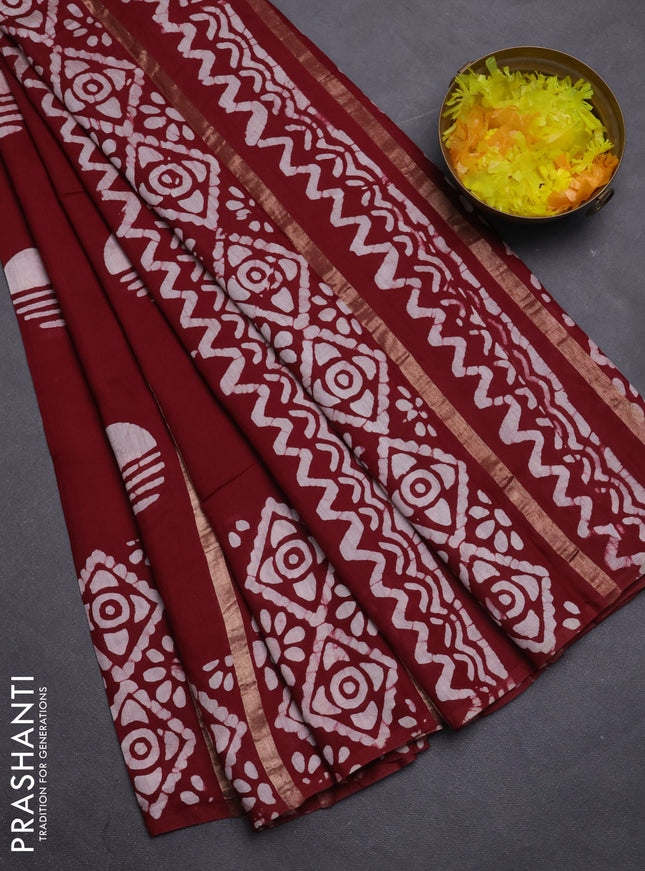 Semi chanderi saree maroon with allover zari strips & batik butta prints in borderless style