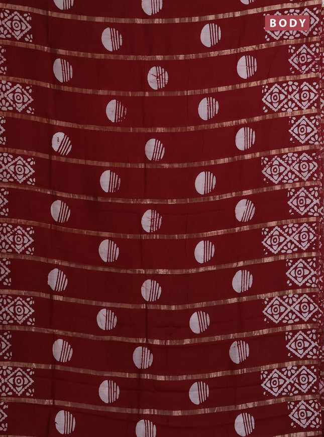 Semi chanderi saree maroon with allover zari strips & batik butta prints in borderless style