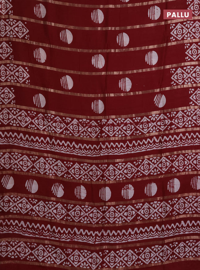 Semi chanderi saree maroon with allover zari strips & batik butta prints in borderless style