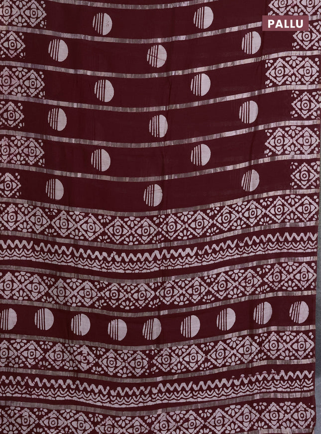 Semi chanderi saree deep maroon with allover zari strips & batik butta prints in borderless style
