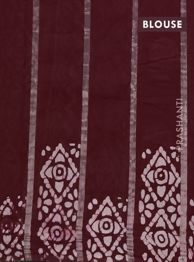 Semi chanderi saree deep maroon with allover zari strips & batik butta prints in borderless style