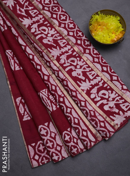Semi chanderi saree maroon with allover zari strips & batik butta prints in borderless style