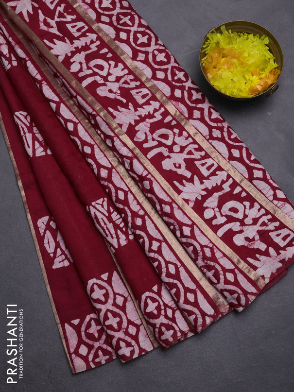 Semi chanderi saree maroon with allover zari strips & batik butta prints in borderless style