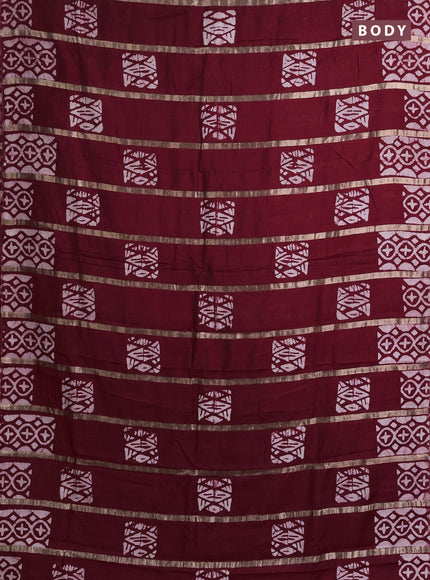 Semi chanderi saree maroon with allover zari strips & batik butta prints in borderless style
