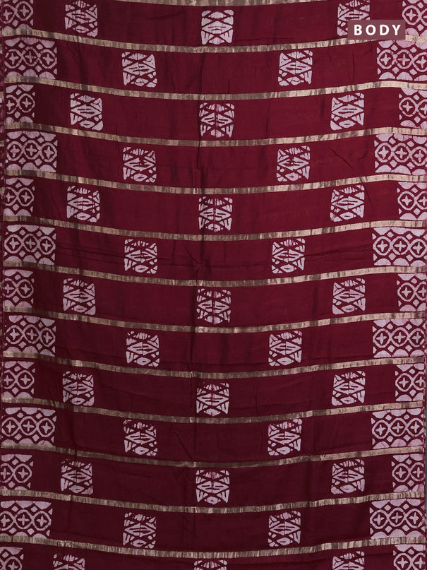 Semi chanderi saree maroon with allover zari strips & batik butta prints in borderless style