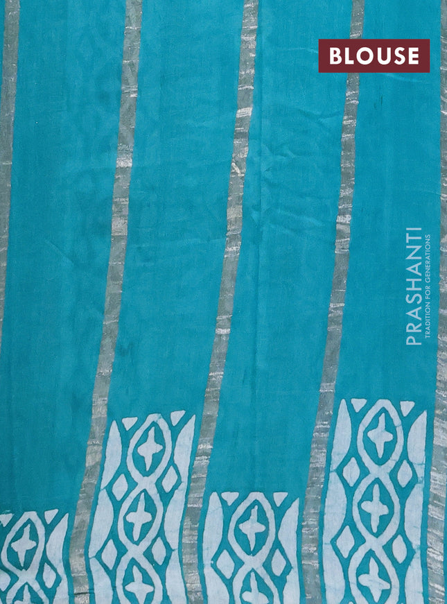 Semi chanderi saree teal green with allover zari strips & batik butta prints in borderless style
