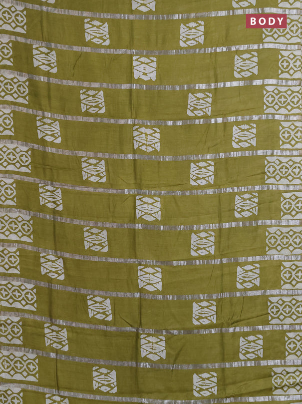 Semi chanderi saree mehendi green with allover zari strips & batik butta prints in borderless style