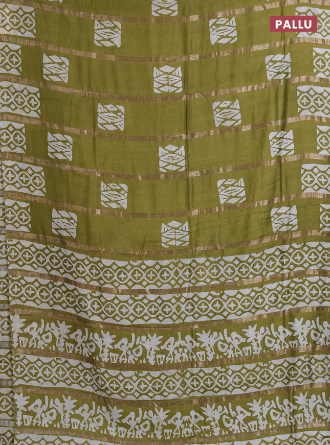Semi chanderi saree mehendi green with allover zari strips & batik butta prints in borderless style
