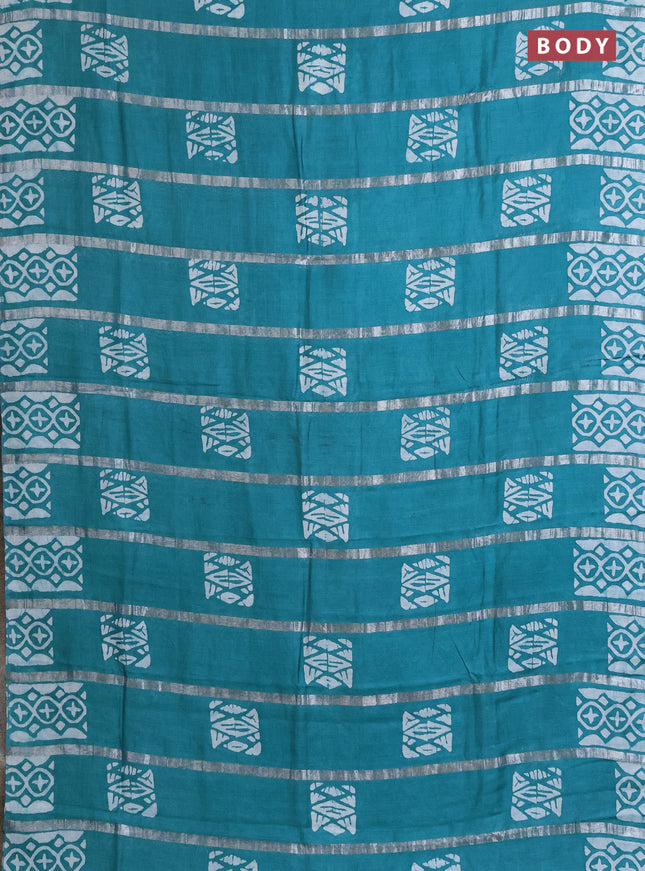 Semi chanderi saree teal blue with allover zari strips & batik butta prints in borderless style