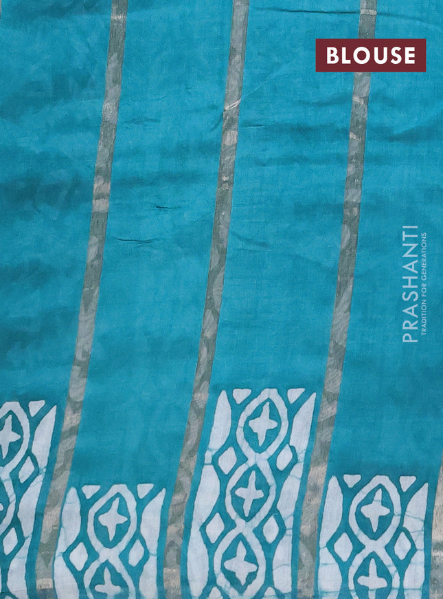 Semi chanderi saree teal blue with allover zari strips & batik butta prints in borderless style