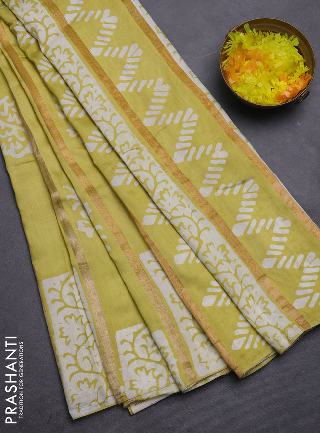 Semi chanderi saree lime yellow with allover zari strips & batik butta prints in borderless style