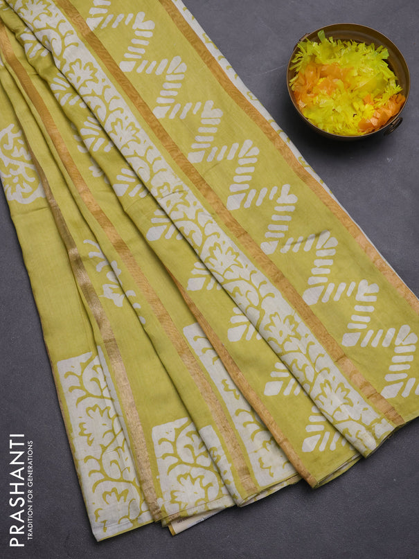 Semi chanderi saree lime yellow with allover zari strips & batik butta prints in borderless style