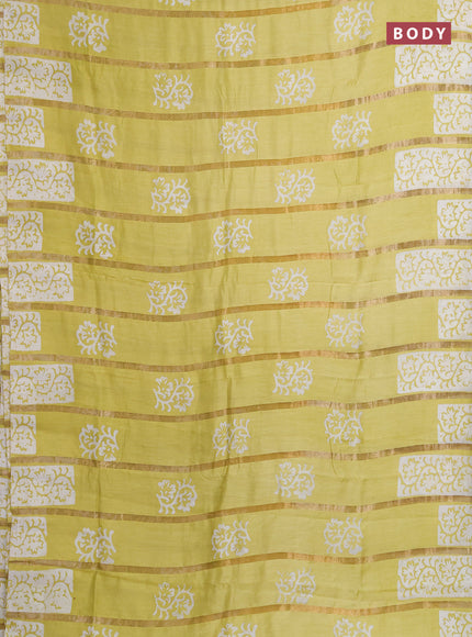 Semi chanderi saree lime yellow with allover zari strips & batik butta prints in borderless style