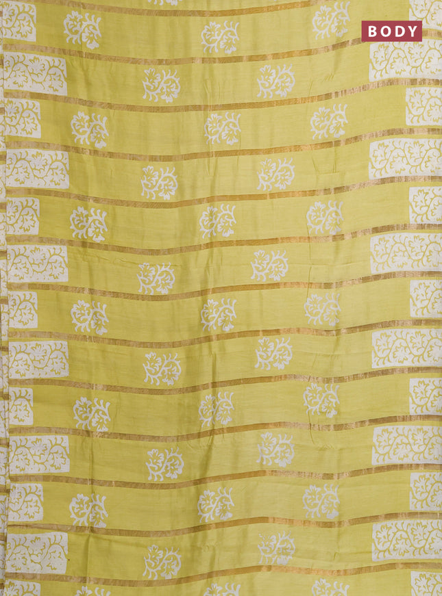 Semi chanderi saree lime yellow with allover zari strips & batik butta prints in borderless style