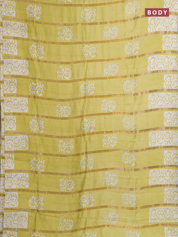 Semi chanderi saree lime yellow with allover zari strips & batik butta prints in borderless style