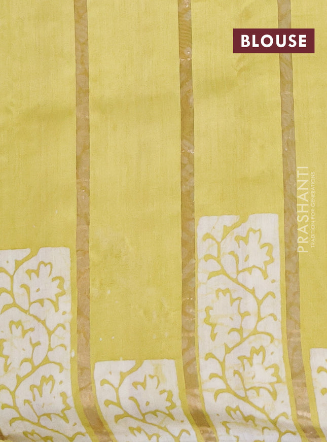 Semi chanderi saree lime yellow with allover zari strips & batik butta prints in borderless style