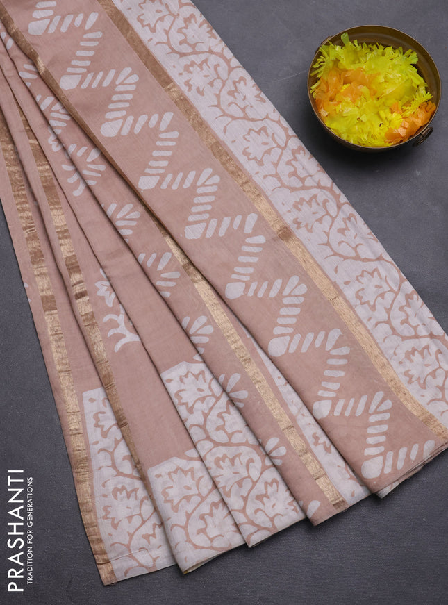 Semi chanderi saree sandal with allover zari strips & batik butta prints in borderless style