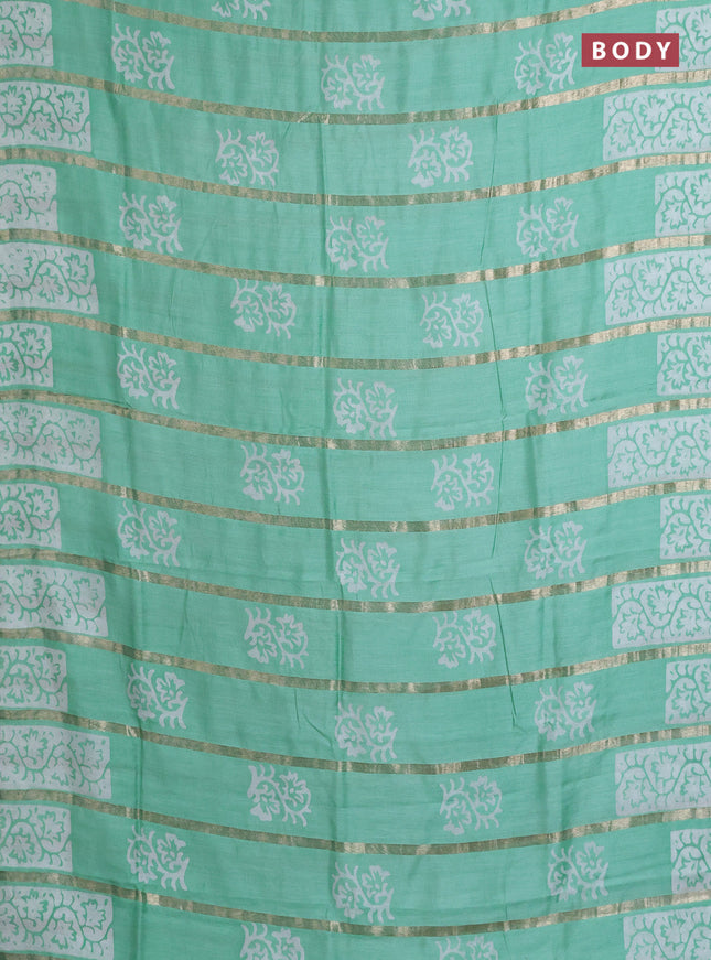 Semi chanderi saree teal green with allover zari strips & batik butta prints in borderless style
