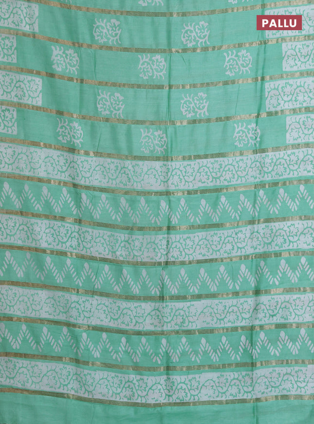 Semi chanderi saree teal green with allover zari strips & batik butta prints in borderless style