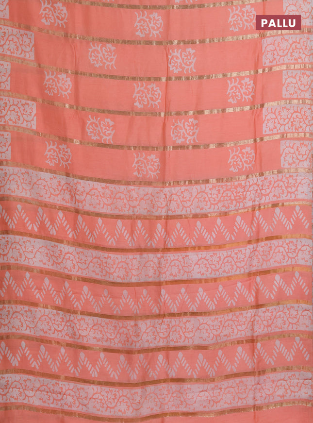 Semi chanderi saree peach orange with allover zari strips & batik butta prints in borderless style