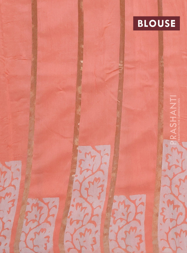 Semi chanderi saree peach orange with allover zari strips & batik butta prints in borderless style