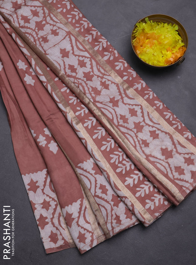 Semi chanderi saree pastel brown with allover zari strips & batik butta prints in borderless style