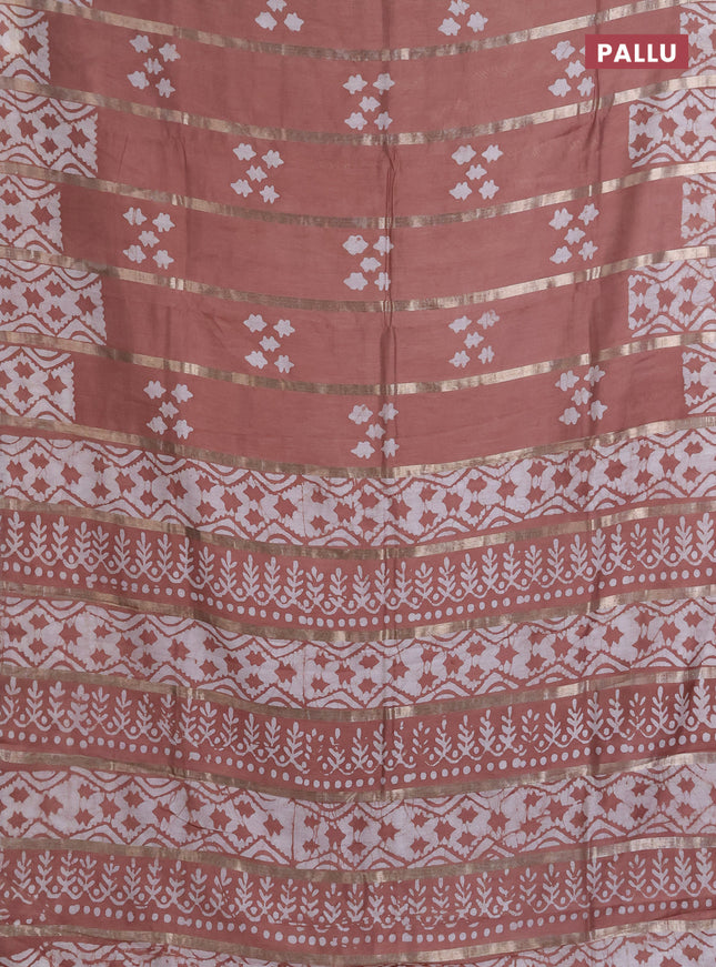 Semi chanderi saree pastel brown with allover zari strips & batik butta prints in borderless style
