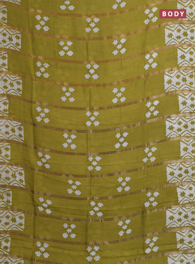 Semi chanderi saree mehendi green with allover zari strips & batik butta prints in borderless style