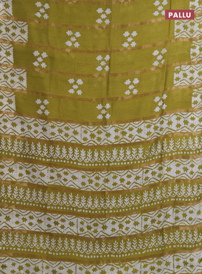 Semi chanderi saree mehendi green with allover zari strips & batik butta prints in borderless style