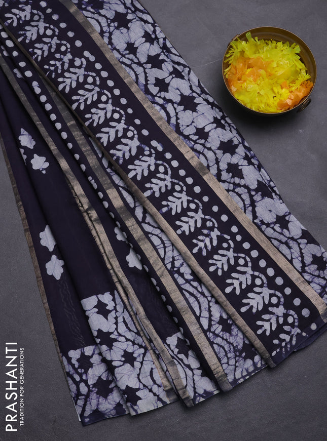 Semi chanderi saree navy blue with allover zari strips & batik butta prints in borderless style