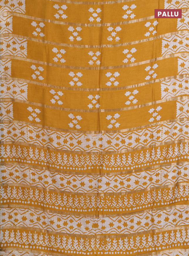 Semi chanderi saree mustard yellow with allover zari strips & batik butta prints in borderless style