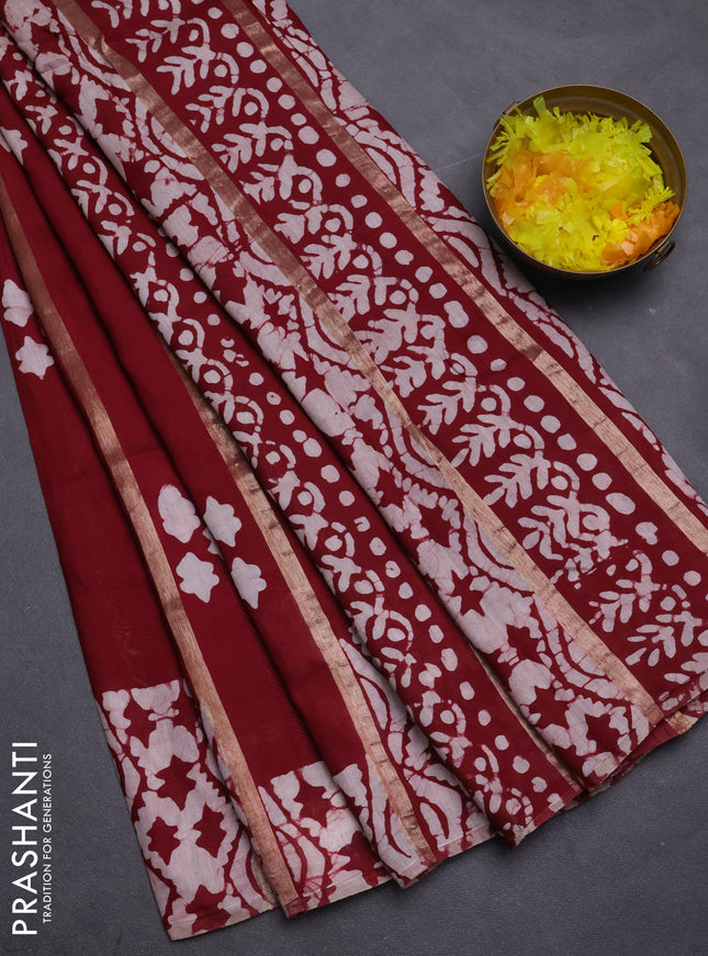 Semi chanderi saree maroon with allover zari strips & batik butta prints in borderless style