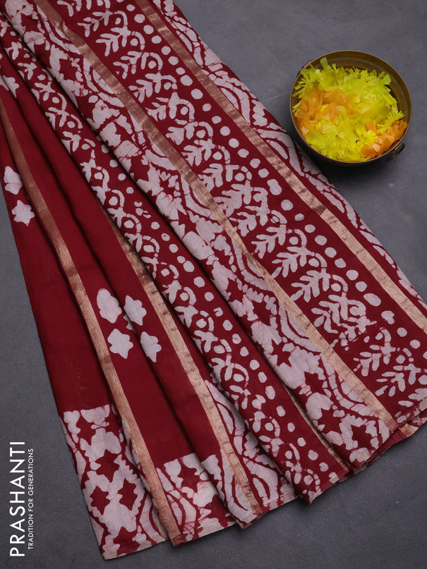 Semi chanderi saree maroon with allover zari strips & batik butta prints in borderless style