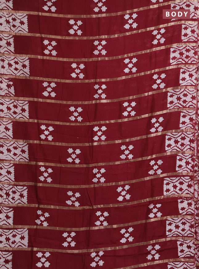 Semi chanderi saree maroon with allover zari strips & batik butta prints in borderless style