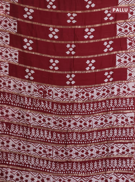 Semi chanderi saree maroon with allover zari strips & batik butta prints in borderless style
