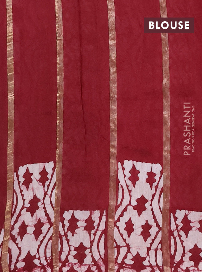 Semi chanderi saree maroon with allover zari strips & batik butta prints in borderless style