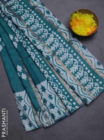 Semi chanderi saree peacock green with allover zari strips & batik butta prints in borderless style