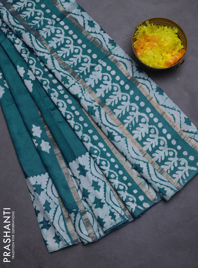 Semi chanderi saree peacock green with allover zari strips & batik butta prints in borderless style