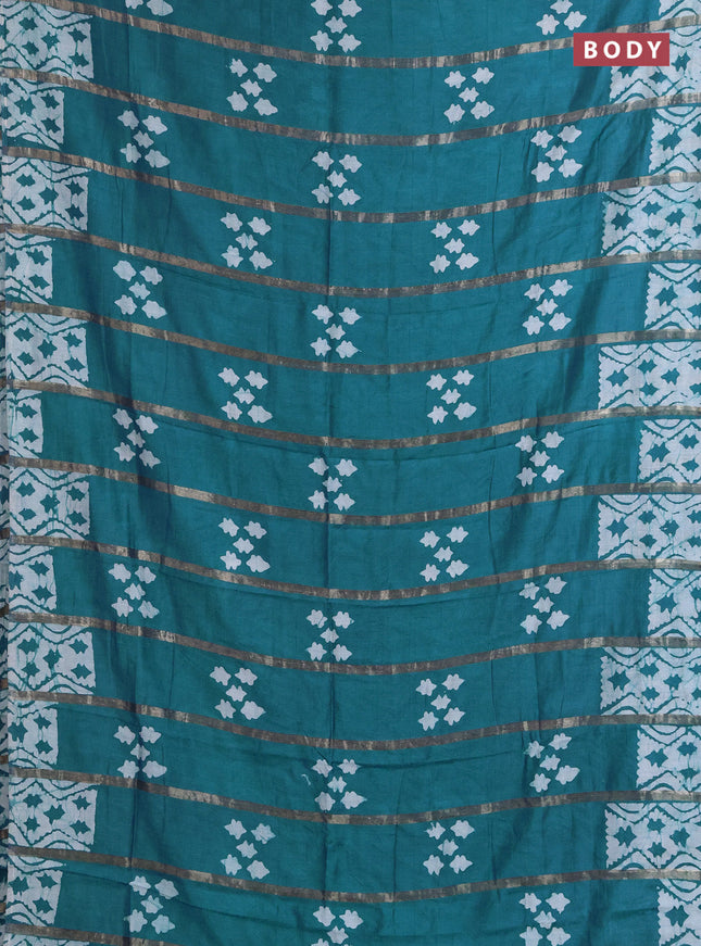 Semi chanderi saree peacock green with allover zari strips & batik butta prints in borderless style