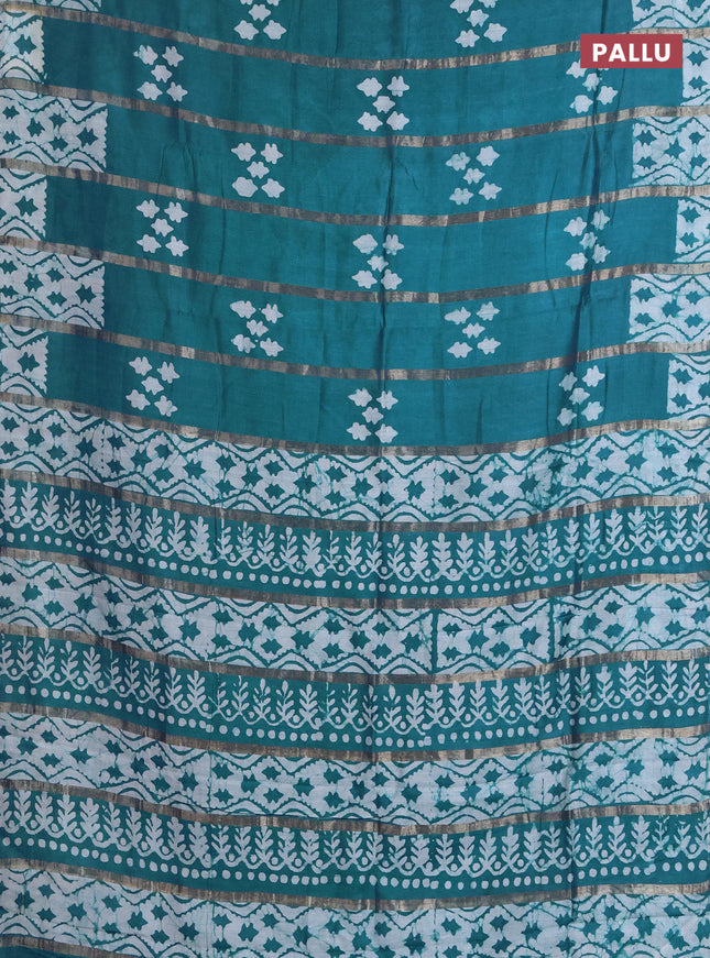 Semi chanderi saree peacock green with allover zari strips & batik butta prints in borderless style