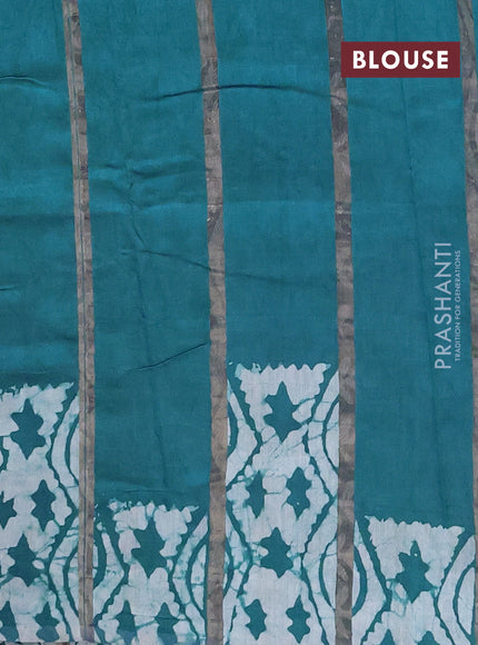 Semi chanderi saree peacock green with allover zari strips & batik butta prints in borderless style