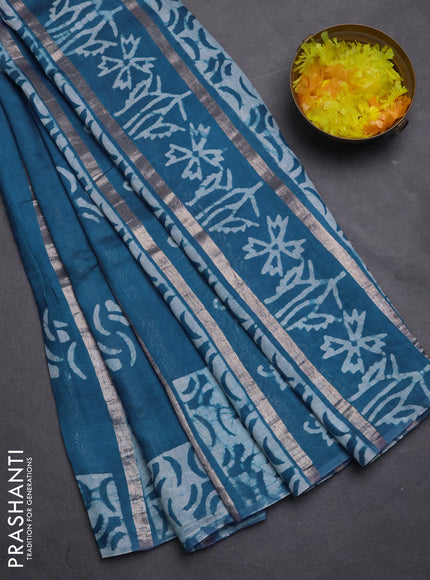Semi chanderi saree peacock green with allover zari strips & batik butta prints in borderless style
