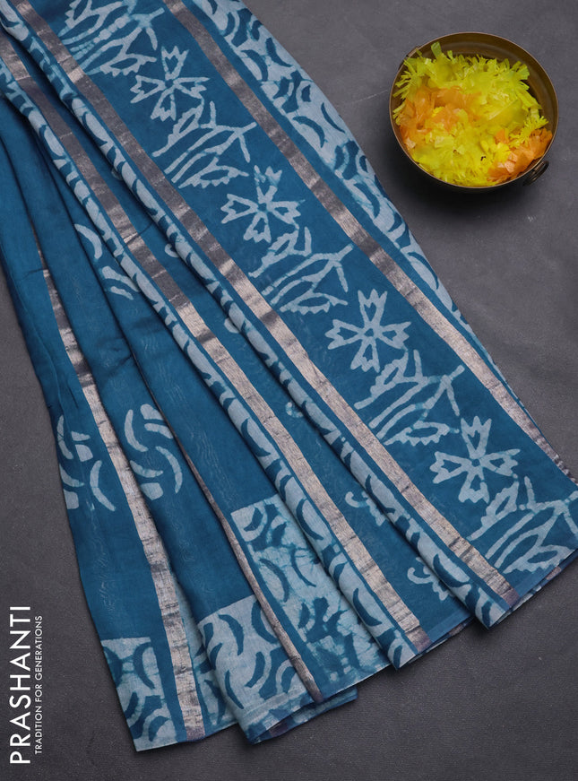 Semi chanderi saree peacock green with allover zari strips & batik butta prints in borderless style