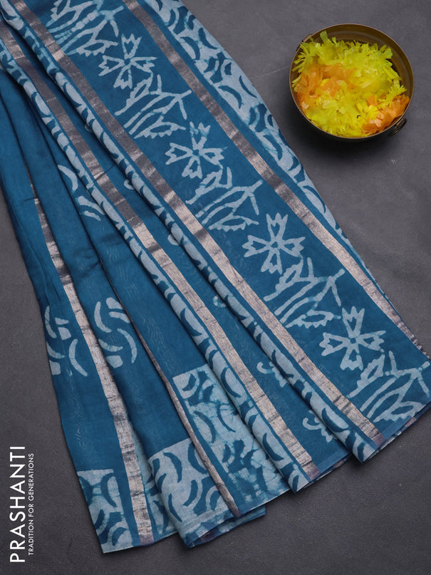 Semi chanderi saree peacock green with allover zari strips & batik butta prints in borderless style