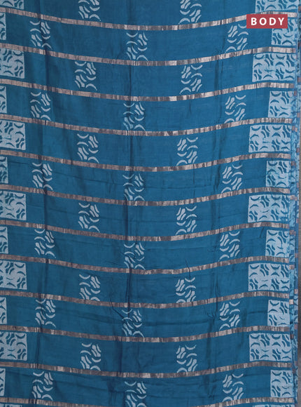 Semi chanderi saree peacock green with allover zari strips & batik butta prints in borderless style